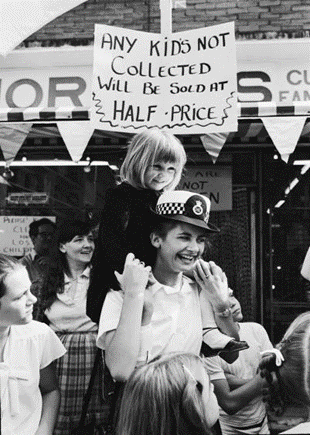 East Street Market 1980. Metropolitan Police officer, Jenny Hanks, with a lost girl.  X.png