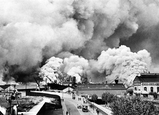 Redriff Road 1940, and the first day of what became known as The Blitz. The ship is in Greenland Dock and Osprey Street is over to the right.  X.png