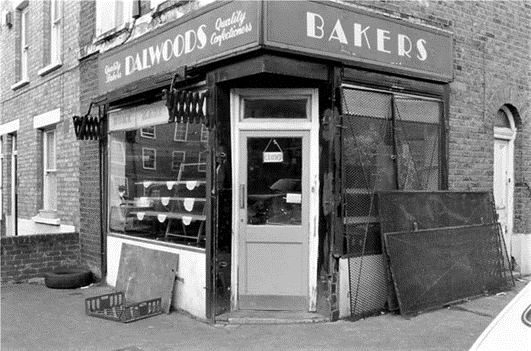 Bagshot Street, c1988. Dalwoods Bakers on the corner with Smyrk's Road.  X.png