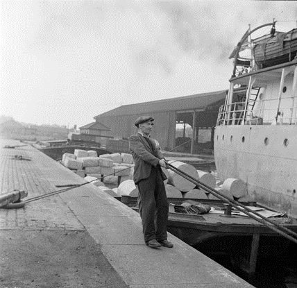Surrey Commercial Docks. Winchman working to get the boat into the dock c1953.  X.png