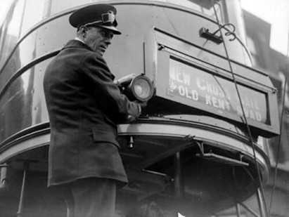 Old Kent Road c1930, LCC Driver Fixing New Fog Lamps on to a Tram.   X.jpg