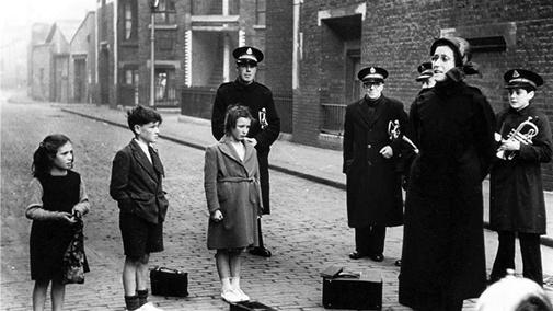 Mint Street SE1. The Salvation Army preacher and musicians plus audience outside Ilfracombe Buildings just off Marshalsea Road.   X.png