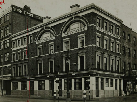 Blackfriars Road at the junction with Stamford Street, The Garibaldi Pub. damaged during an air raid in 1941, and subsequently demolished.  X.png