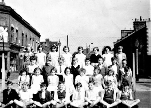 Inville Road, Michael Faraday School Annex looking across Inville Road into Dawes Street. c.1950s. The school would have been behind the photographer.  X.png