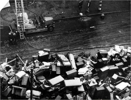 St Georges Road, furniture removed from Taylors Great Central Depository and piled up in the street, 31 January 1941.   X..png