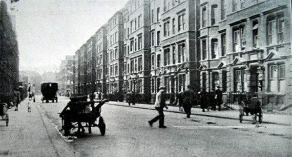 Sayer Street SE17, c1933, looking towards the New Kent Road. Weymouth Dwellings at the far end on the right, with the Weymouth Arms Pub far end left.  X..png