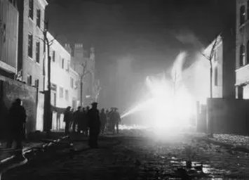Blitz in London, firefighters at work at a burning gas main in Long Lane, Bermondsey, 8 March 1941.  X..png