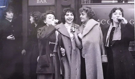Peek Frean Christmas Party 1956, girls drinking outside a pub.  X..png