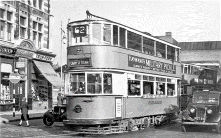 Short Street SE1. A tram and black taxi exit into Newington Butts in 1950.  X..png