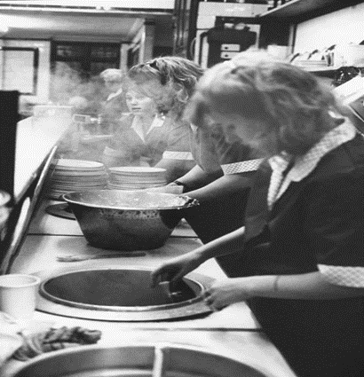 Tower Bridge Road, M.Manze’s eel & pie shop,1991. Denise, Joanne and Michelle clean up after another 'sold-out' day. X..png