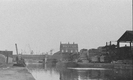 Surrey Canal, c1931, looking towards Plough Road crossing the canal. (Now Plough Way), in the background the Plough Pub.  X..png