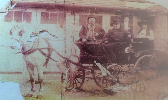 Neate Street, Matthew Nugent, two daughters and son-in-law at the nearby stables in Willowbrook Grove, around 1900.  X..png