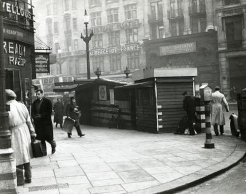 London Road, Elephant & Castle, c1944. Travel information kiosk.   X..png