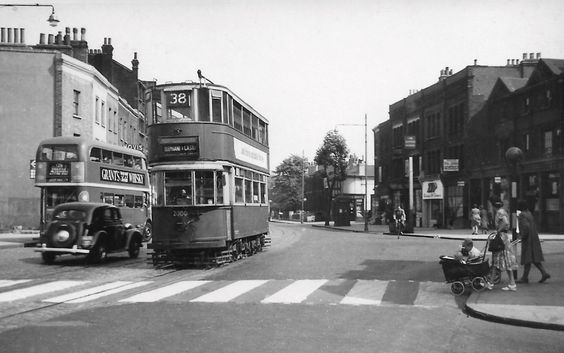 Old Kent Road, c1952. Commercial Way and the Kentish Drovers Pub right, to the left is the South Metropolitan Gasworks. Asylum Road on right just past the Police Box.  X..png