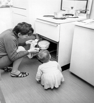 Anchor Street. Gas at Pope House on the Manor Estate 1968, all appliances having now changed to electric power Mrs Christine Dedman, and her daughter Sheila, get the first meal ready. X..png
