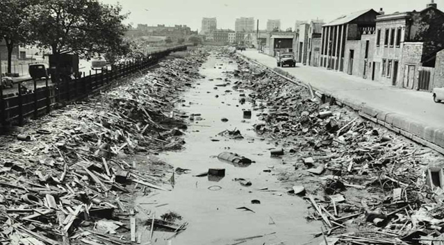 Surrey Canal from St George's Bridge, c1960. I think that is Elmington Estate, Wyndham Road in the distance.  X..png