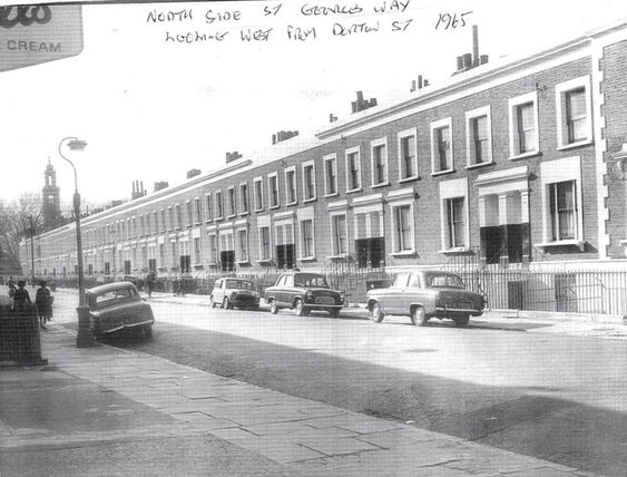 St George Way 1965. St Georges Church in Wells Way in the distance right. The pub Live and Let Live was on the corner of Dorton Street left.  X..png