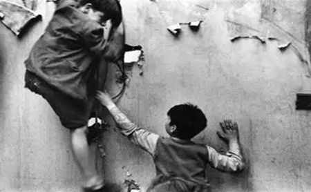 2 Bermondsey children playing in the bomb out houses 1954.   X..png