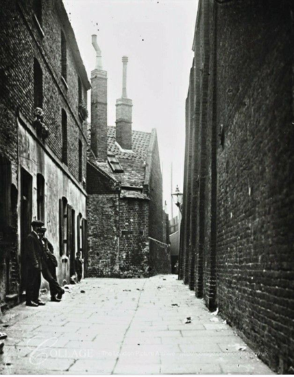 Angel Place, Borough High Street. Marshalsea Prison Wall right.   X..png