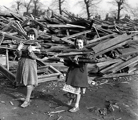 WW2, Bermondsey, March 1941, two young girls take away firewood from a Dump.  X..png