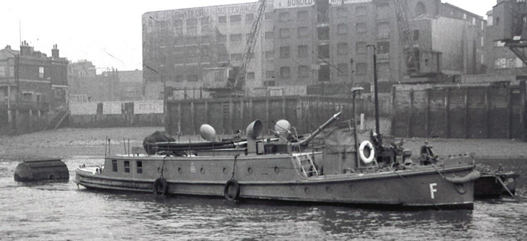 Bermondsey Wall East, The Beta III on the river at Rotherhithe moored close to fire station RZ4 at Cherry Garden Pier - and with Angel Pub far left.  c1941.  X..jpg