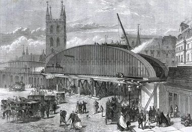 London Bridge Station. The massive iron bridge carrying the railway over the roadway and forward to Charing Cross, c1863.   X..png