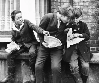 Eating fish and chips out of newspaper, c1961.  X..png