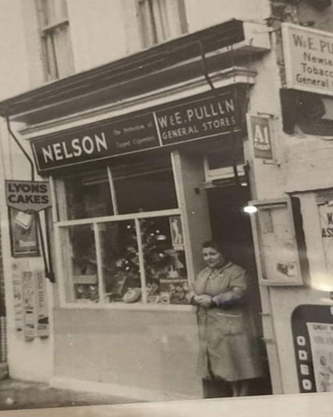 Wells Way on the corner of Coleman Road, Camberwell. Pullen's the General Store, c1963.  X..png