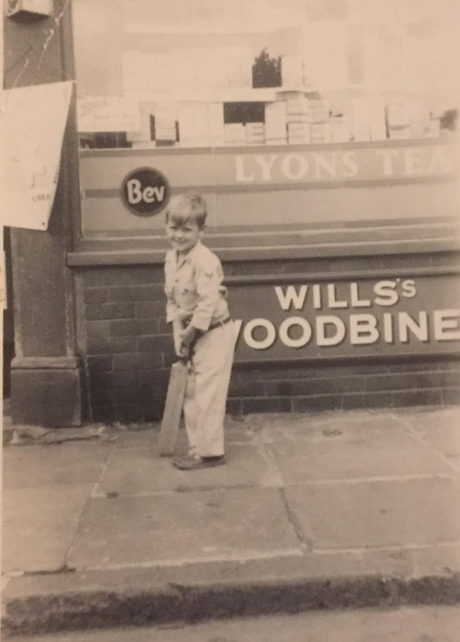 Stalham Street, Bermondsey , Mick Perkins outside is nans sweet shop, mid 1950s. X..jpg