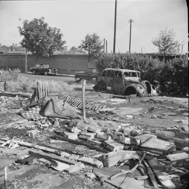 Rolls Road, prefabricated homes being demolished 1962. Bricklayers' Arms Goods Depot wall in the background.  2 X..png