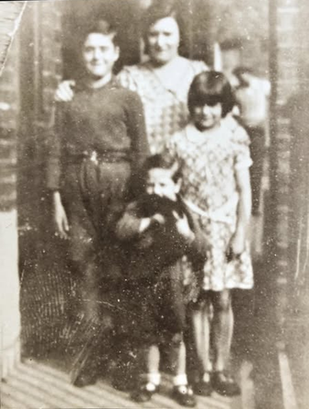 3. Pages Walk, Harold Estate,  Charlie Pauly his sister Betty and little brother George with their Mum Mary (Nee. New).   1   X..png