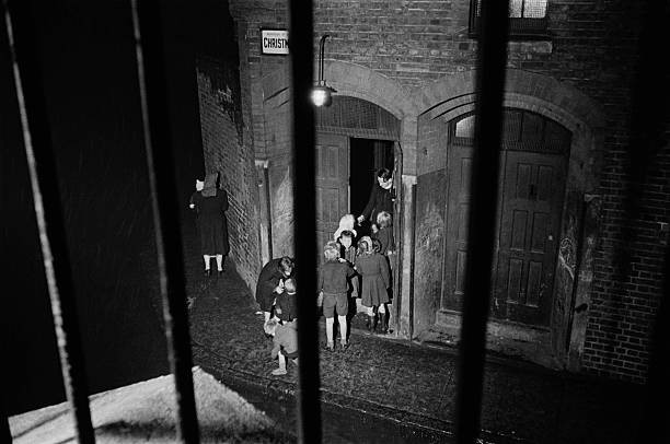 Christmas Street, Tower Bridge Road, children entering a church in 1946. .jpg
