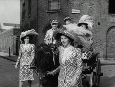 1. Massinger Street, Pearly Kings and Queens travel by horse and cart to the Annual Costers Harvest Festival at St. Mary Magdalene Church on Old Kent Road,1949.    X..png