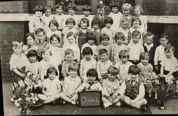 Larcom Street, St Johns School, Ronald Hines actor, sitting front row on the right with his tie hanging out. Mid-1930s. X..png