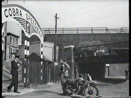 FILM ONCE A JOLLY SWAGMAN 1949.  Bill Fox (Dirk Bogarde) The railway line and bridge no longer there, the land to the right is occupied by buildings on John Williams Close. X..png