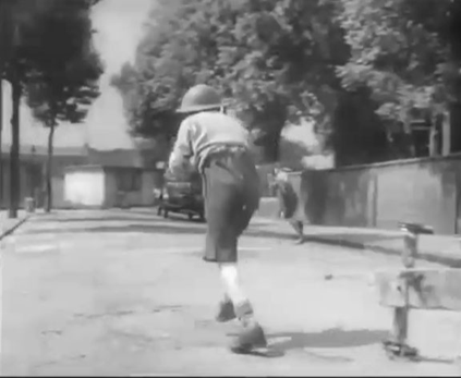 Film Once a Jolly Swagman, Avondale Square, bombed St. Philip's Church to the right, prefab at the end is number 68. X..png