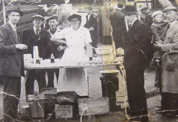 East Street c1935, Charlie Slaney to the ladies right and  Jim Beales next to him..png