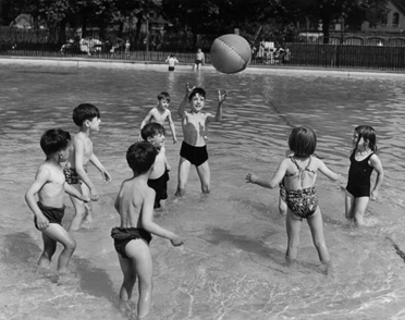 Southwark  Park Lido c1953. A group of children keeping cool playing with a beach ball..png