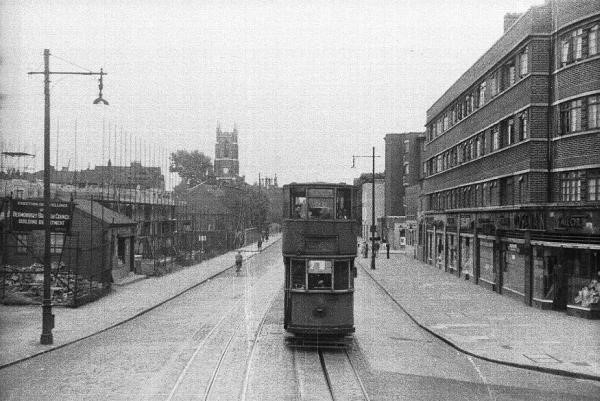 Tram in Jamaica Road Southwark park road is in the right had side and west lane is on the left. The tram is coming from Rotherhithe Tunnel way..jpg