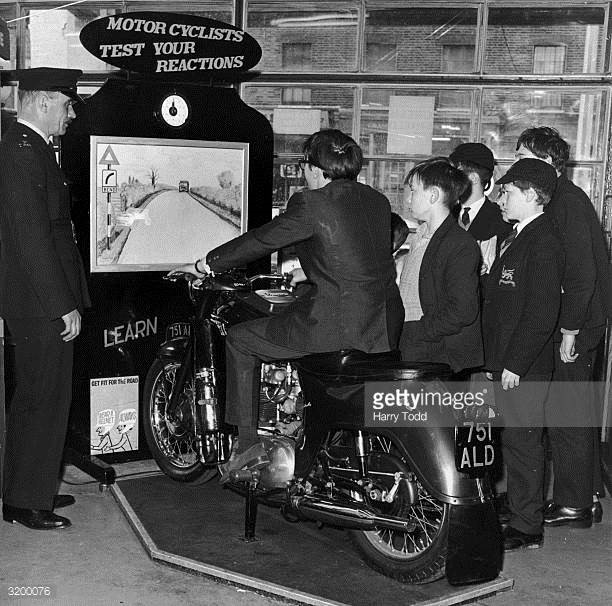 Boys from Bermondsey trying a new road safety machine at their local police station (the Simulator.).jpg