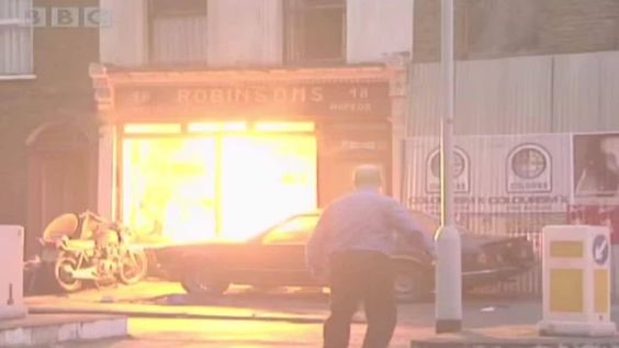 Eastenders being filmed in 2002 in Old Jamaica Road Bermondsey South East London England. The Old Robinson Bike Shop On Fire.jpg