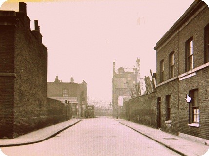 Looking towards Tabard Street from outside the Church, The Crown Pub can be seen on the far right and a builders yard between the houses and before the pub,.jpg