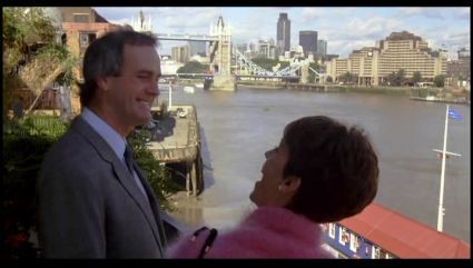 FILM A FISH CALLED WANDA 1988. Stars, John Cleese--Jamie Lee Curtis, Looking towards Tower Bridge and St. Katherine Docks.  X.jpg
