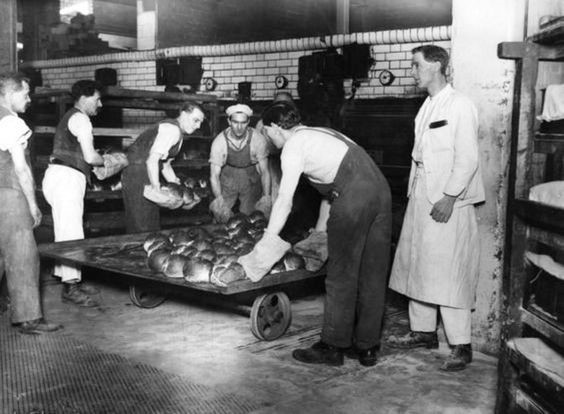 Spa Road, c1926, Fresh bread being taken out of an oven at the Bermondsey Co-operative's Bakery..jpg