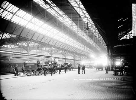 London Bridge Station with Royal Mail horse-drawn vehicles in the foreground. 1870 – 1900  X.jpg