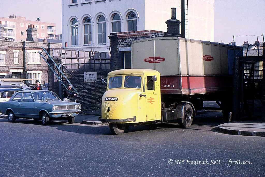 Dunton Road Exiting the British Rail goods yard is a Scammell Scarab and trailer. The junction with Lynton Road can be seen behind the Vauxhall Viva. 1969.jpg