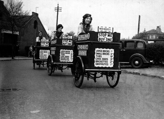 Three ice-cream girls set off on their rounds in London, they have taken over from men who have been called up to the services, 2nd May 1940.jpg