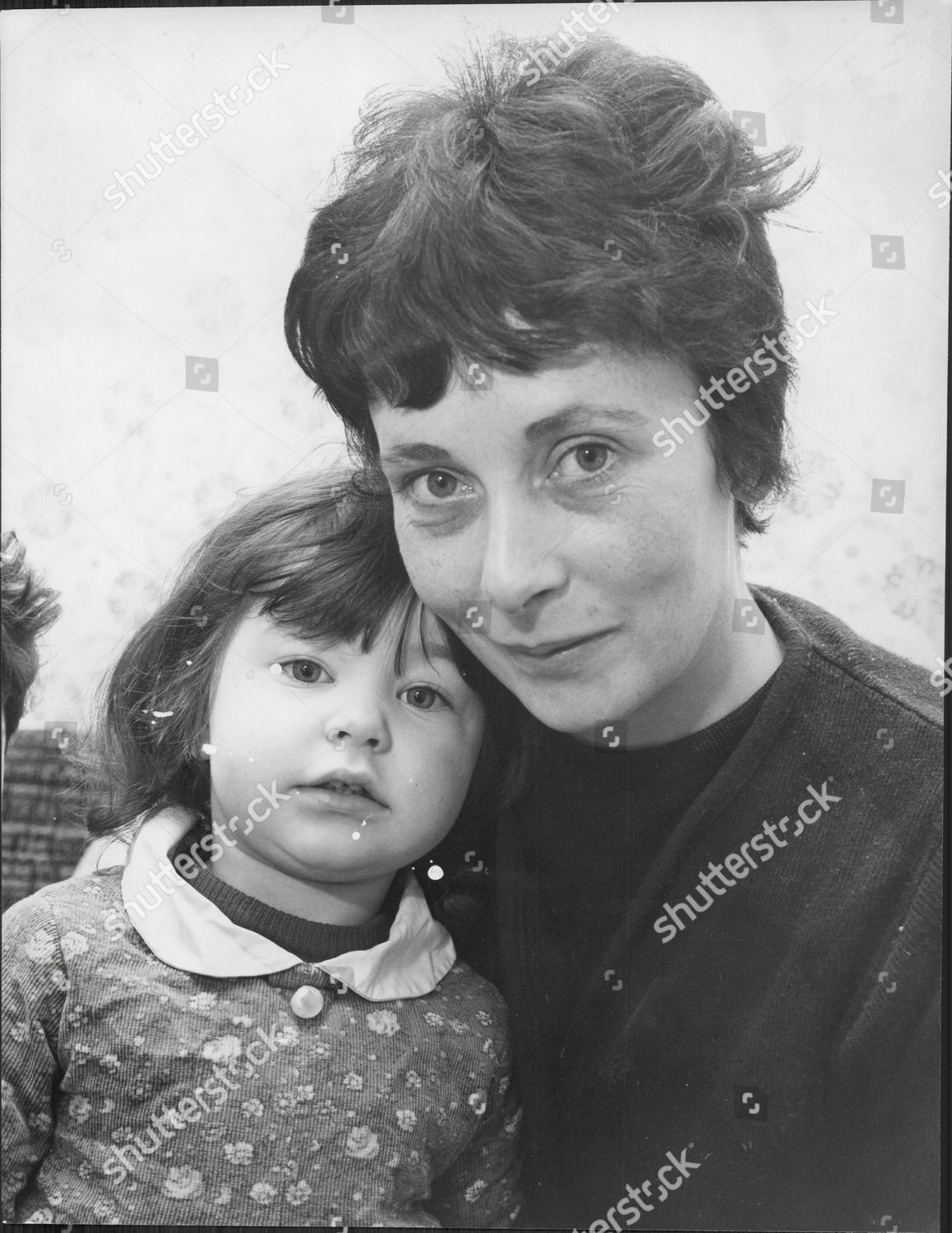 Esmeralda Road. Two Year Old Maria Whalebone At Home, She Is Pictured Siting On The Spin Dryer She Got Caught In. She Is Pictured With Her Mother Teresa Whalebone c1970..png