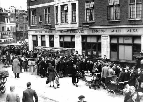 Westmorland Road Camberwell, 1947, The Red Lion pub. Housewives queuing for potatoes during rationing..jpg