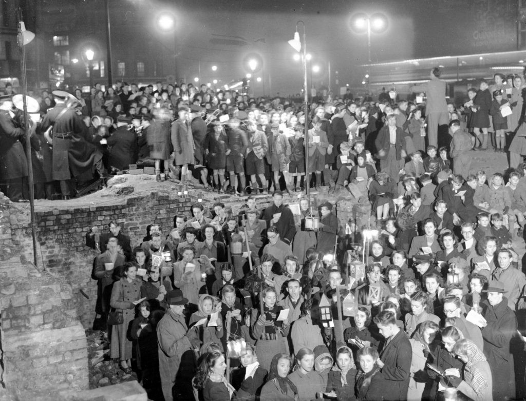 Elephant and Castle, c1948, that year, people gather at a bomb site to sing carols and perform a Nativity.  X.jpg